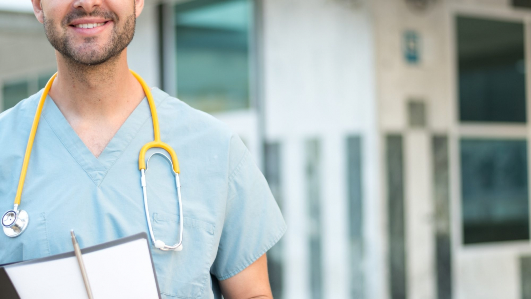 male-nurse-with-stethoscope-MBQ4P3Y-2000x1125